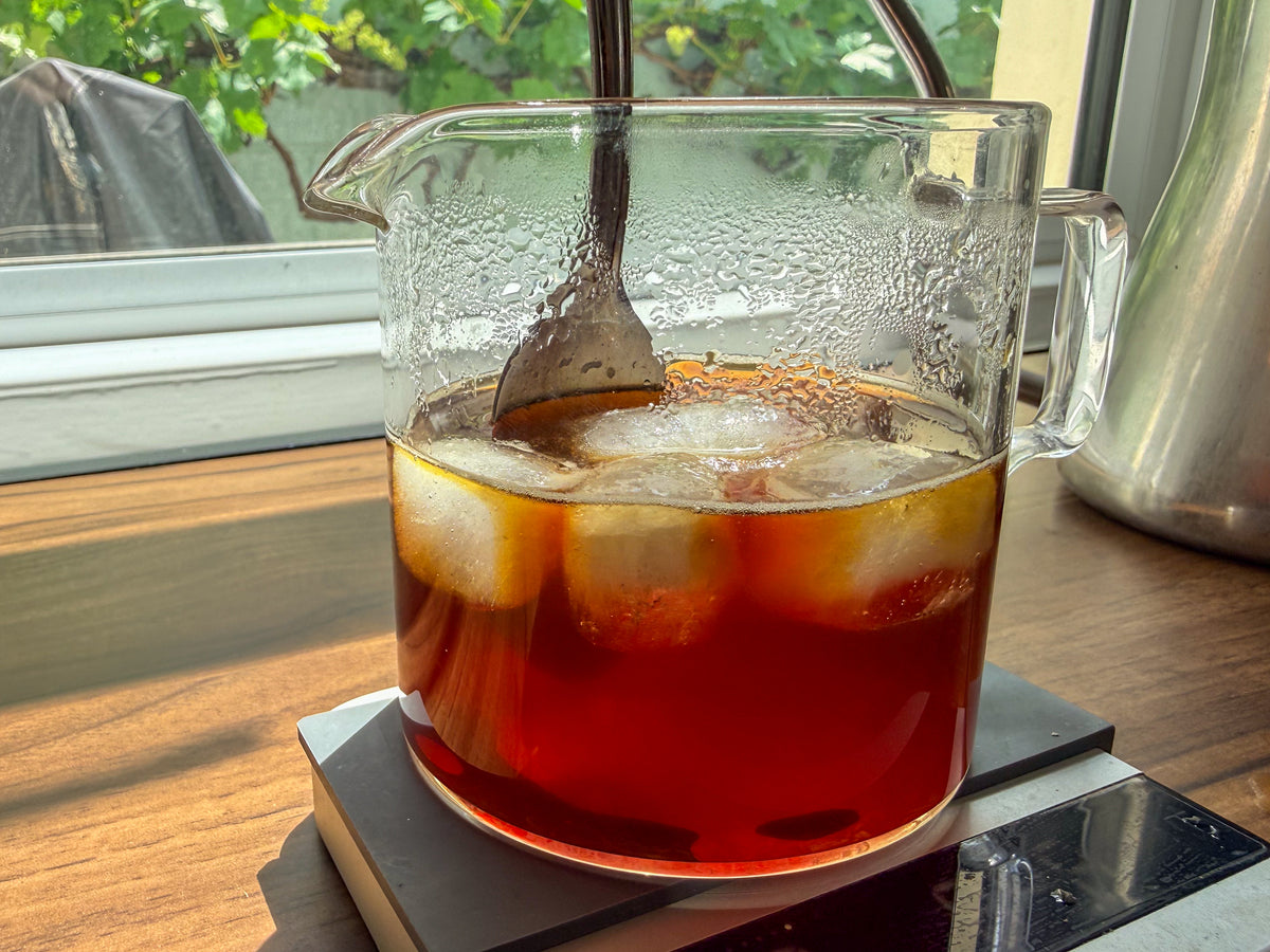Stirring Ice into coffee, with our speciality coffee subscription 